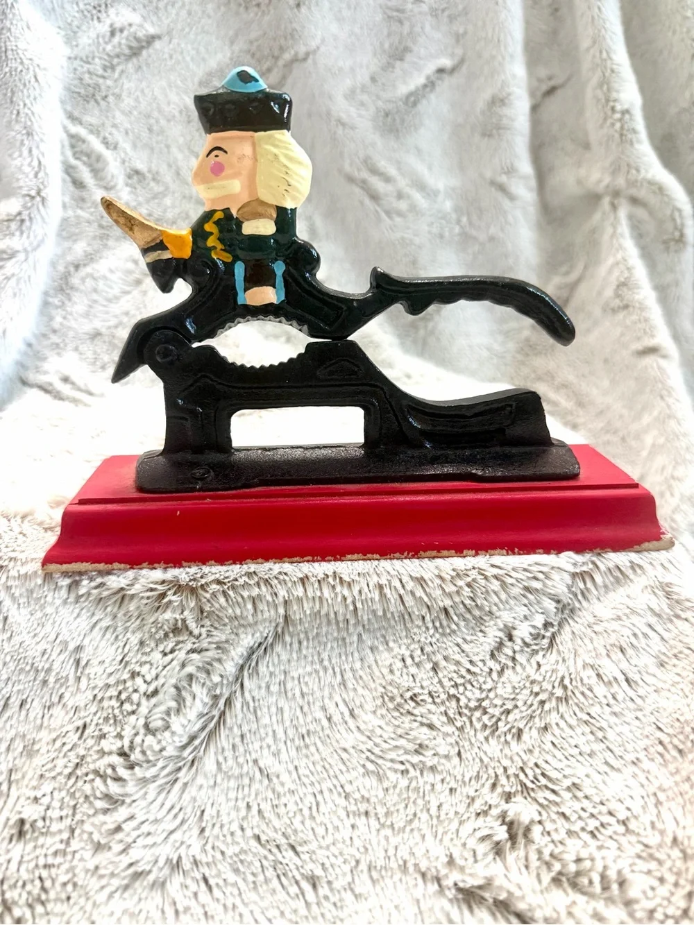 Vintage Cast Iron Nutcracker Figurine on Red Base